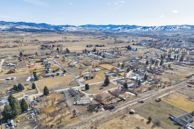 birds eye view of property featuring a mountain view