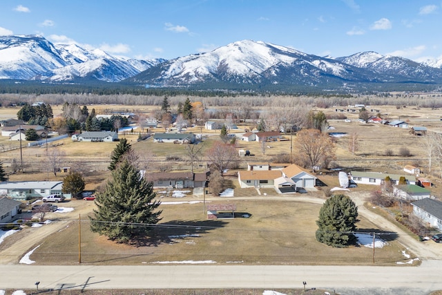 birds eye view of property with a mountain view