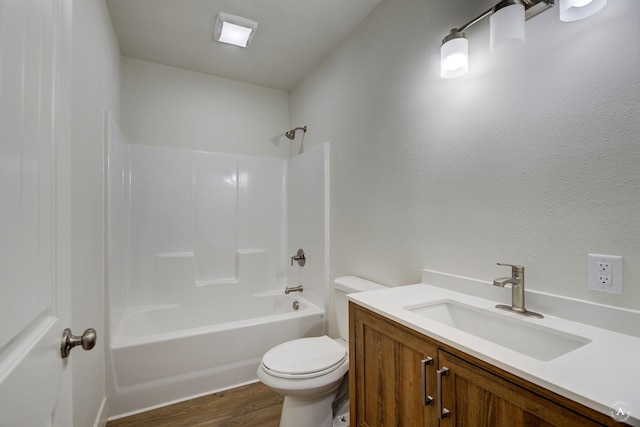 full bathroom with shower / bathtub combination, toilet, vanity, and wood finished floors