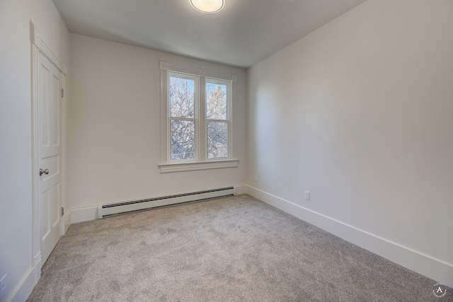 unfurnished bedroom with a baseboard radiator, baseboards, and carpet