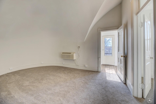 bonus room with lofted ceiling, carpet flooring, and a wall mounted AC