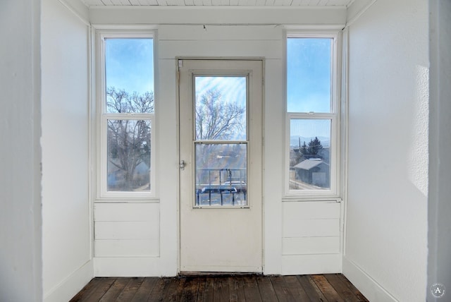 doorway with dark wood-style floors