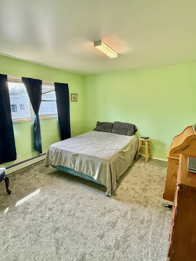 bedroom with carpet flooring and baseboard heating