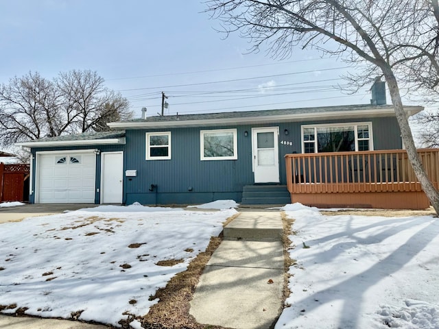 view of front of property with covered porch, a chimney, and a garage