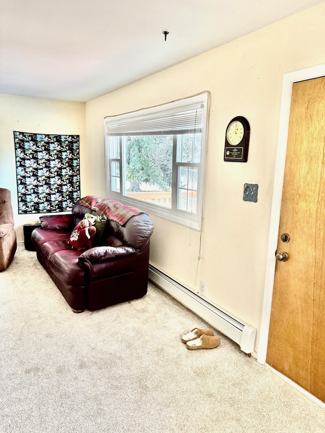 carpeted living area featuring a baseboard radiator