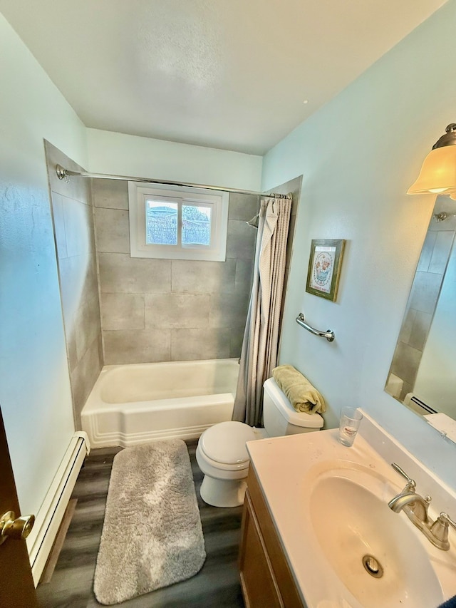 full bathroom featuring vanity, wood finished floors, a baseboard radiator, shower / bath combo with shower curtain, and toilet