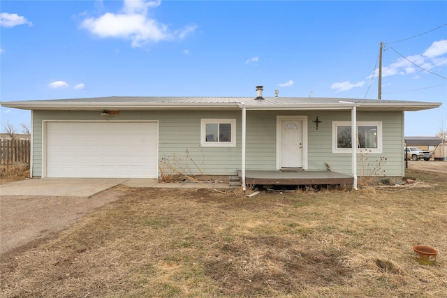 ranch-style house with driveway, a front lawn, a garage, and fence