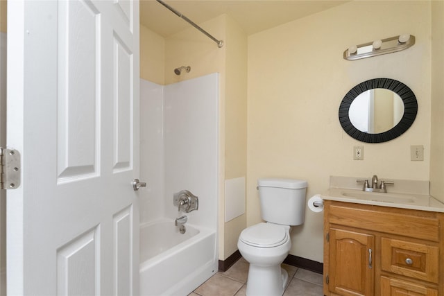 bathroom featuring vanity, baseboards, tile patterned flooring, bathtub / shower combination, and toilet