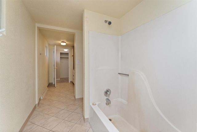 full bathroom with tile patterned flooring, shower / washtub combination, and baseboards