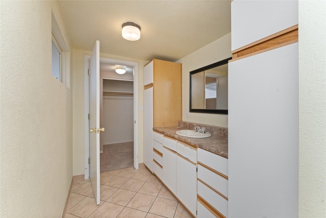 bathroom with vanity and tile patterned flooring