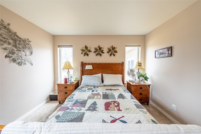 carpeted bedroom with baseboards