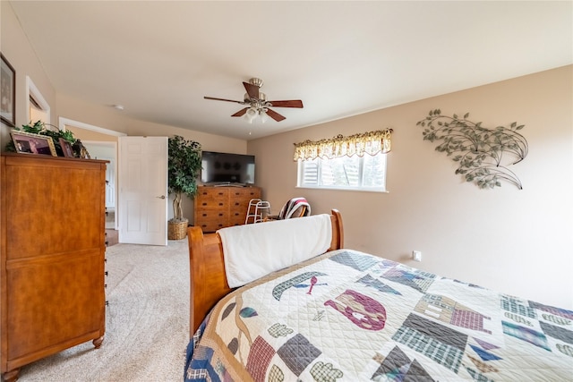 bedroom with a ceiling fan and carpet floors