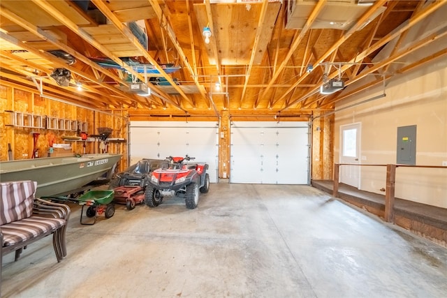 garage with electric panel and a garage door opener