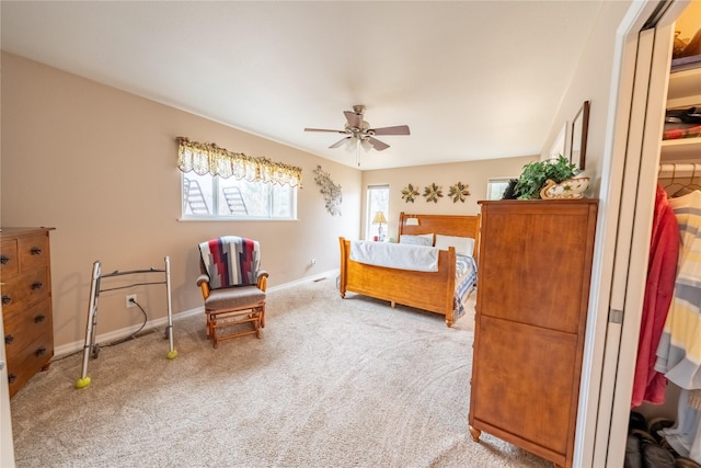 bedroom featuring ceiling fan, baseboards, and carpet floors