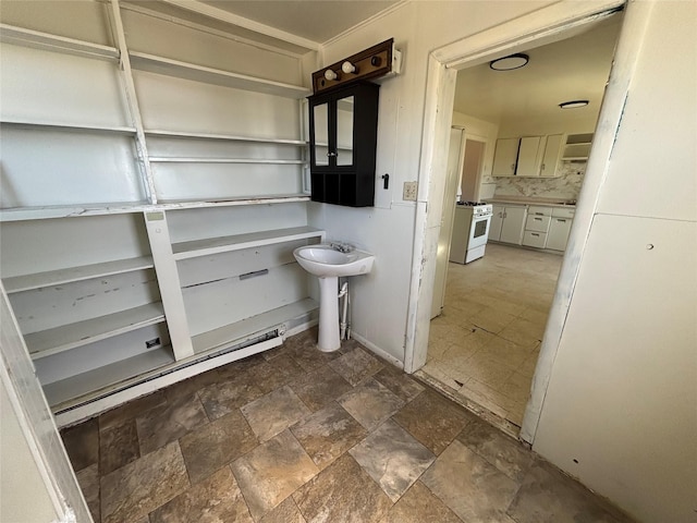 420 Virginia St, Butte, MT 59701 - bathroom featuring stone finish floors and a sink