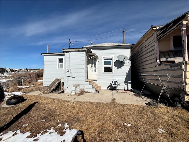 back of house featuring entry steps