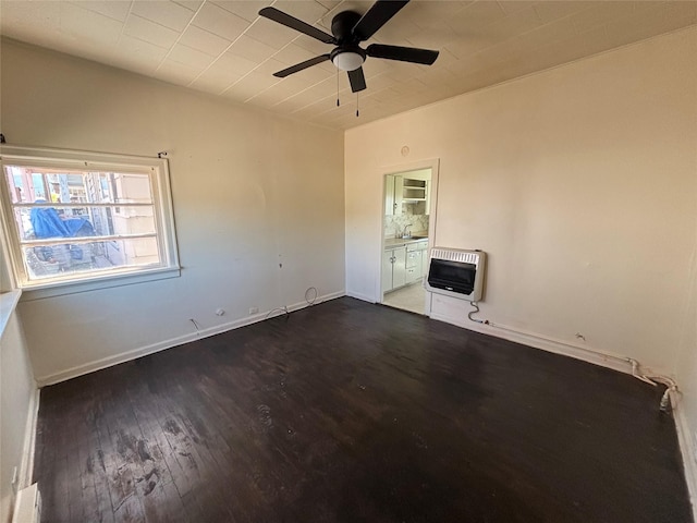 420 Virginia St, Butte, MT 59701 - empty room featuring heating unit, ceiling fan, and wood finished floors