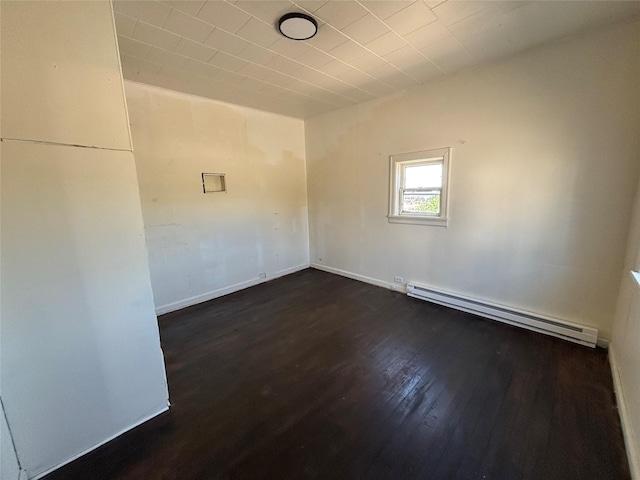 420 Virginia St, Butte, MT 59701 - spare room with a baseboard radiator and dark wood-style floors
