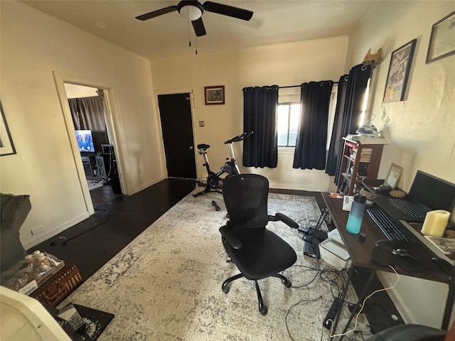 office with baseboards and ceiling fan