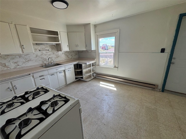 420 Virginia St, Butte, MT 59701 - kitchen with white gas range oven, a baseboard heating unit, white cabinetry, decorative backsplash, and open shelves