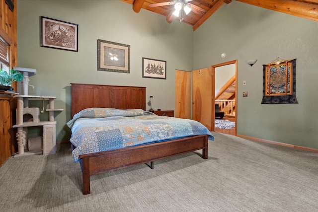 32 Peaceful Ct, Bigfork, MT 59911 - bedroom featuring a wooden ceiling with exposed beams, high vaulted ceiling, carpet flooring, and ceiling fan