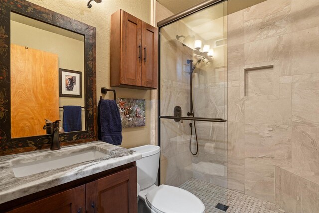32 Peaceful Ct, Bigfork, MT 59911 - bathroom featuring vanity and a shower stall
