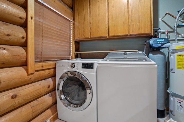 32 Peaceful Ct, Bigfork, MT 59911 - washroom with washer and clothes dryer and cabinet space