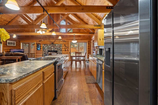 32 Peaceful Ct, Bigfork, MT 59911 - kitchen with appliances with stainless steel finishes, a wooden ceiling with exposed beams, hardwood / wood-style floors, a fireplace, and dark countertops