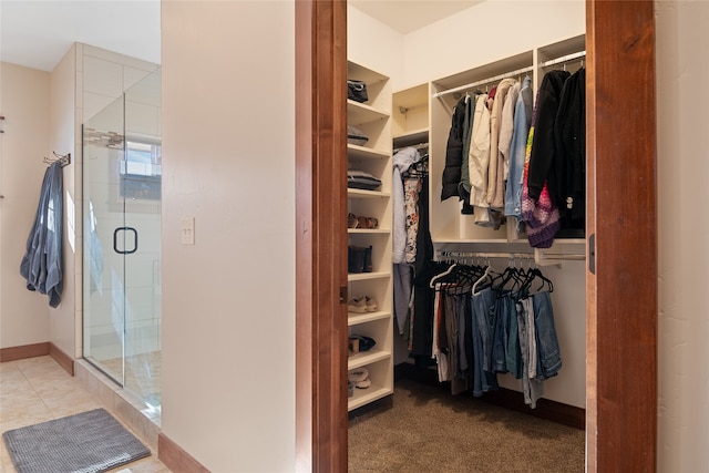 spacious closet featuring tile patterned floors