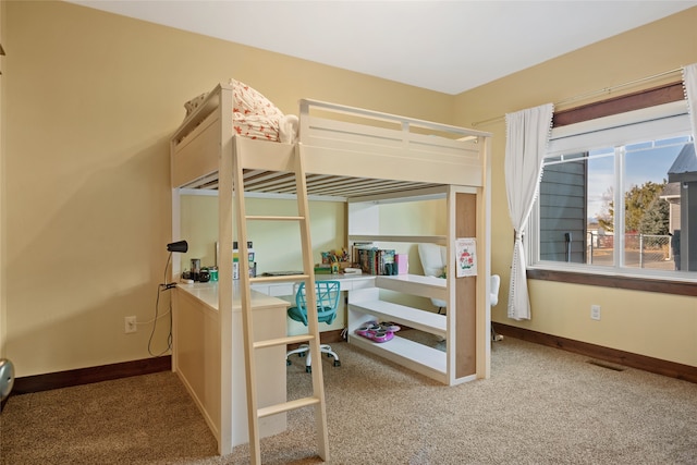 bedroom featuring visible vents, baseboards, and carpet floors