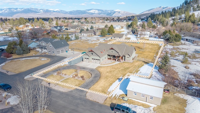 drone / aerial view featuring a mountain view and a residential view