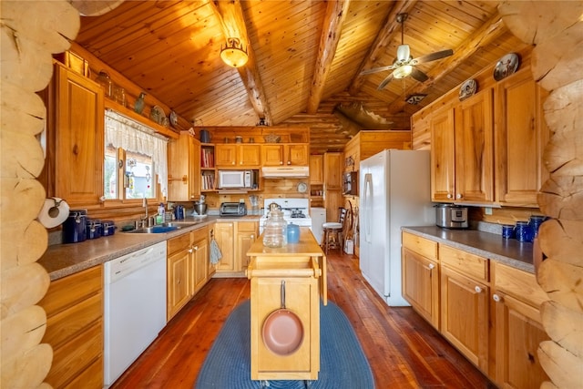 kitchen with white appliances, a kitchen island, a sink, dark wood-type flooring, and under cabinet range hood