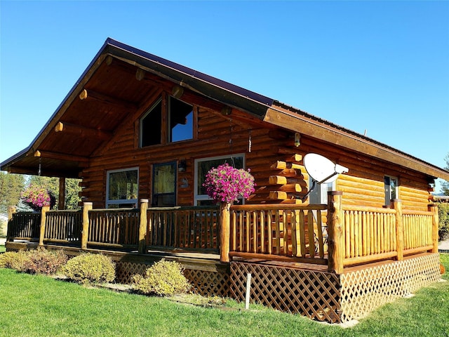 back of house featuring log exterior