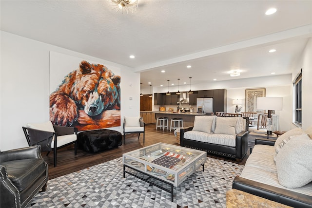 living room with recessed lighting and wood finished floors