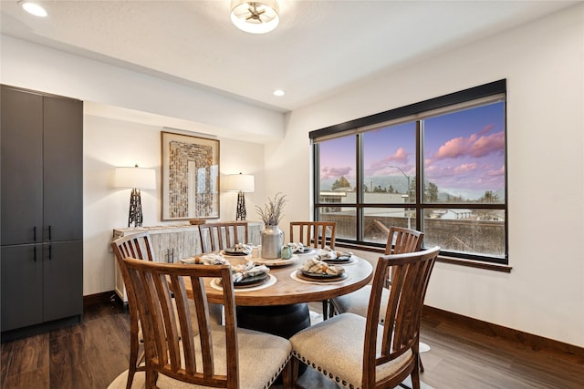 dining room featuring recessed lighting, baseboards, and wood finished floors