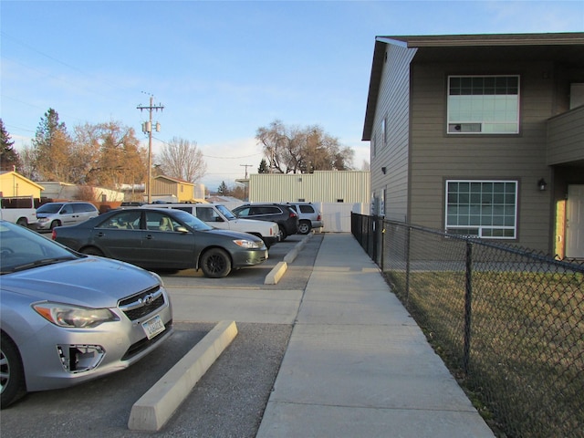 uncovered parking lot with fence
