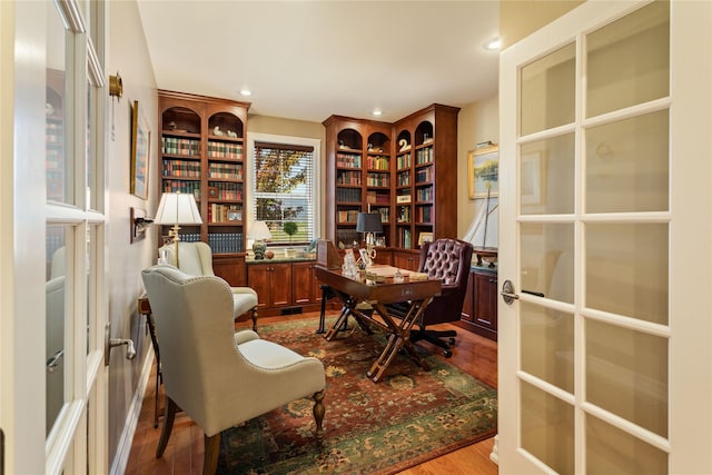 office area featuring dark wood finished floors, recessed lighting, and french doors