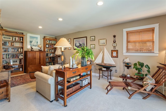 living area with recessed lighting, baseboards, and carpet floors