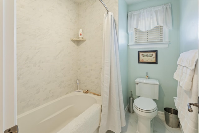 full bath with toilet, shower / tub combo, and baseboards