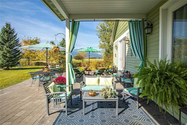 view of patio / terrace with an outdoor living space and outdoor dining area