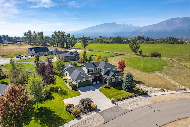 aerial view featuring a mountain view and a rural view