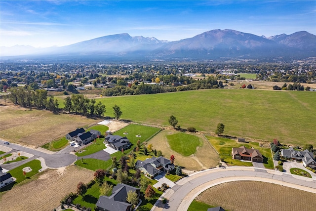 birds eye view of property with a mountain view and a residential view