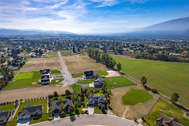 bird's eye view featuring a mountain view, a residential view, and a rural view