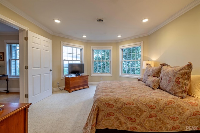 carpeted bedroom featuring recessed lighting, visible vents, baseboards, and ornamental molding