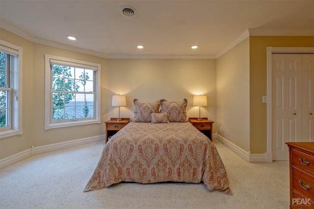 bedroom featuring visible vents, baseboards, light colored carpet, and crown molding