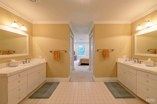 full bathroom featuring crown molding, two vanities, and a sink