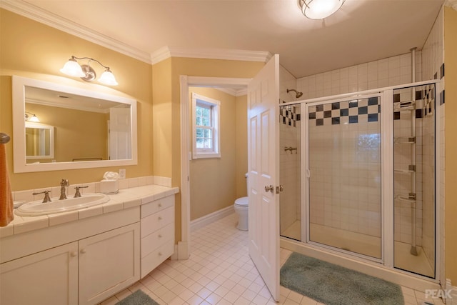 bathroom featuring vanity, toilet, a stall shower, and crown molding