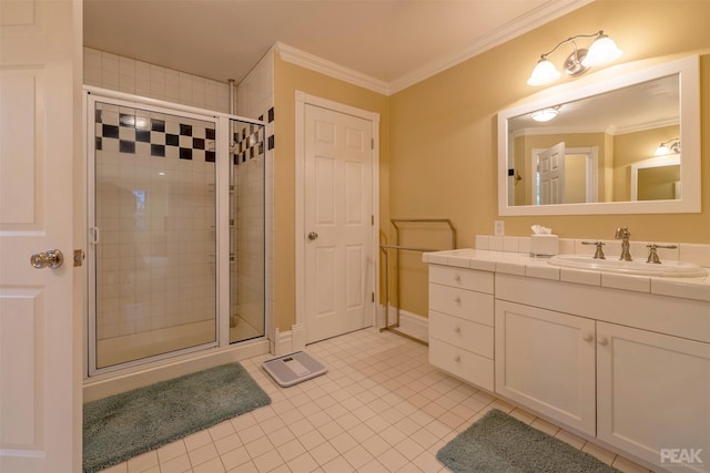 bathroom with tile patterned floors, a stall shower, and ornamental molding