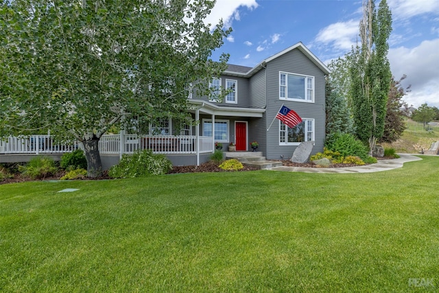 view of front of property with a porch and a front yard