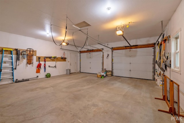 garage featuring a garage door opener